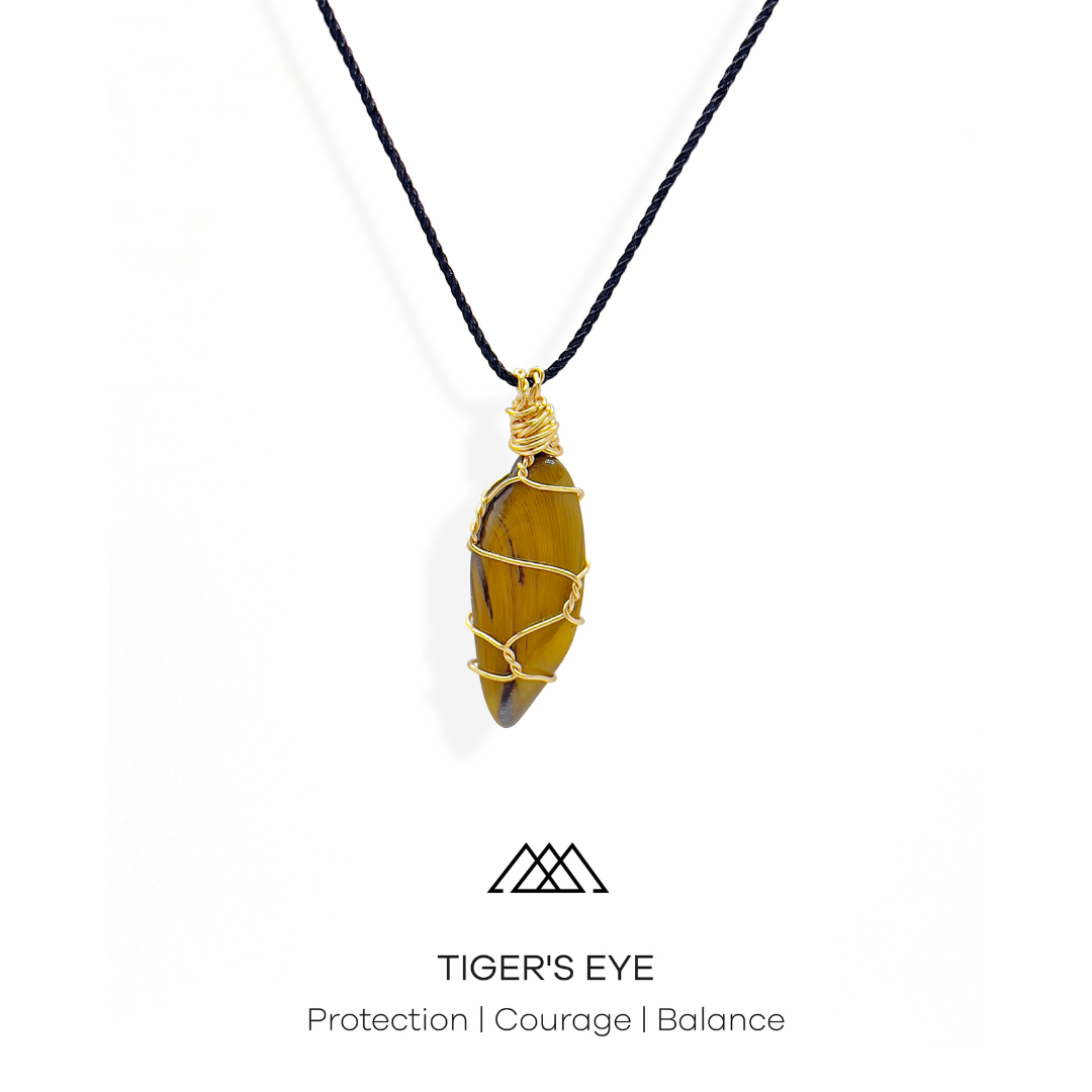 The Tiger's Eye crystal is ideal for promoting protection, courage, and balance. This crystal is expertly wrapped with gold wire, resulting in a one-of-a-kind pendant.