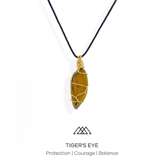 The Tiger's Eye crystal is ideal for promoting protection, courage, and balance. This crystal is expertly wrapped with gold wire, resulting in a one-of-a-kind pendant.